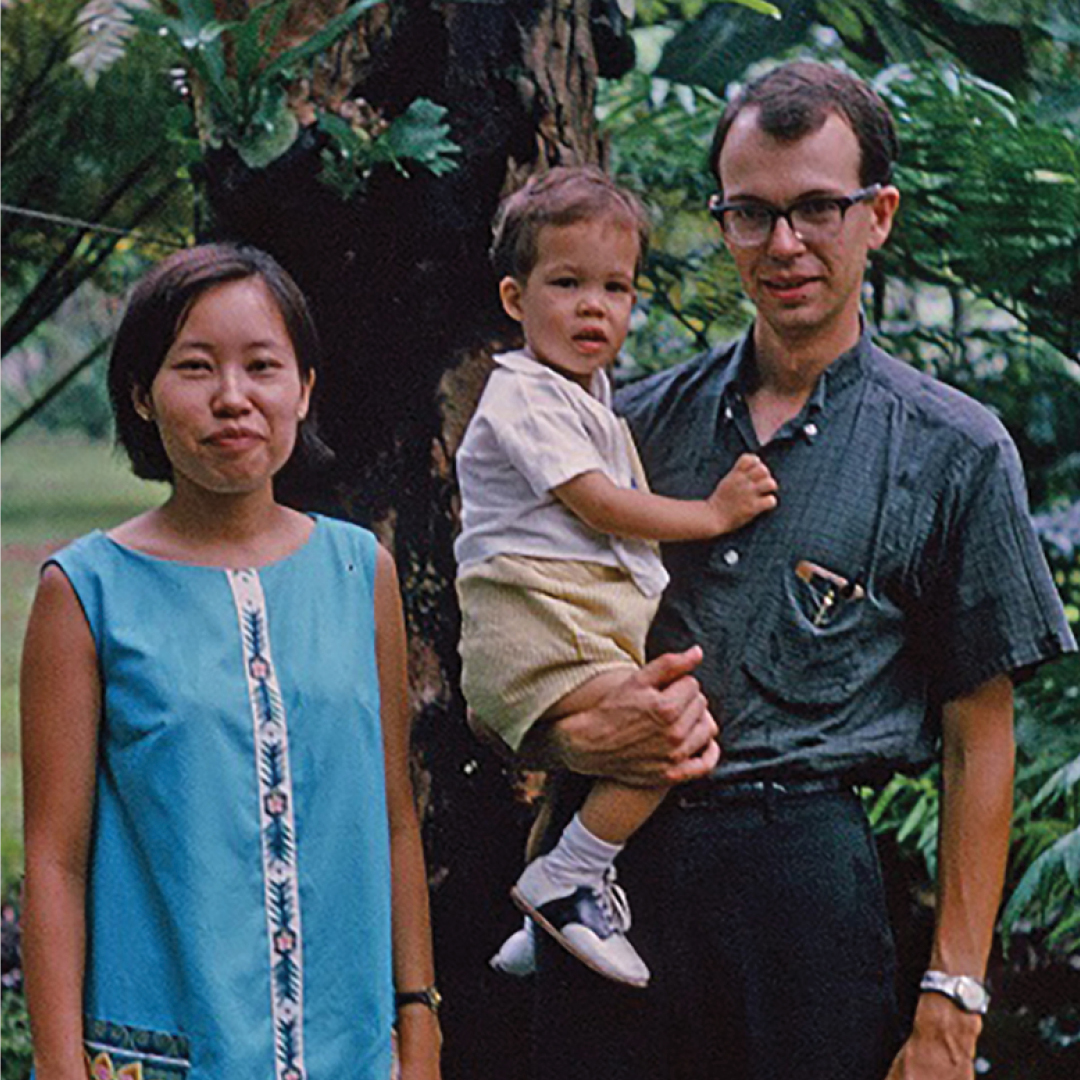 An old photo of Charles Adair and his family in front of a tree