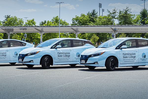 Fleet of electric vehicles next to FSC electric car port