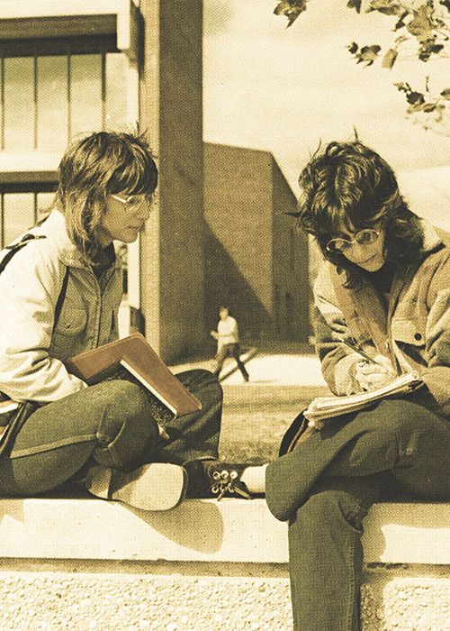 FSC Students sitting outside of Greenley Library in the 1970's